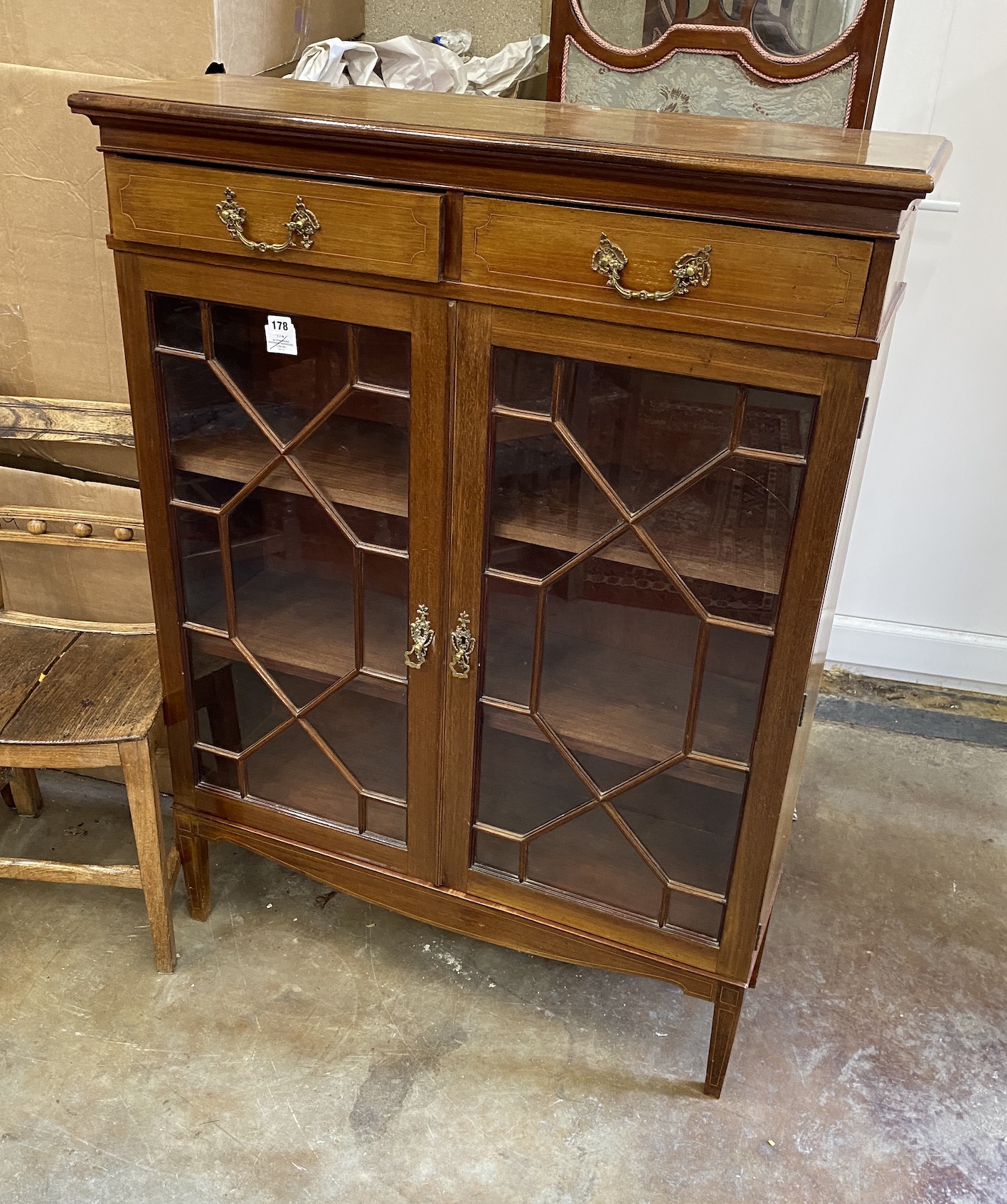 An Edwardian mahogany bookcase, glazed doors, width 95cm, depth 30cm, height 126cm